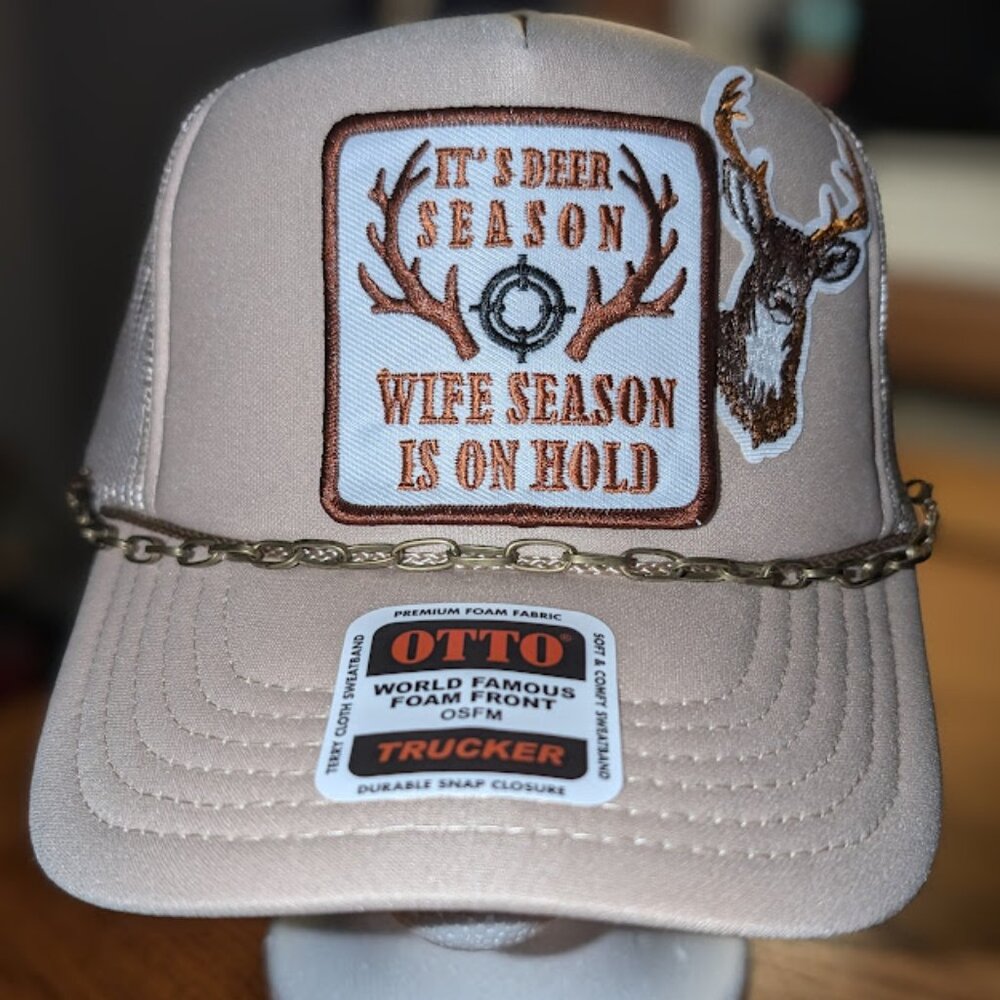 Trucker hat with iron on patches and embellishments